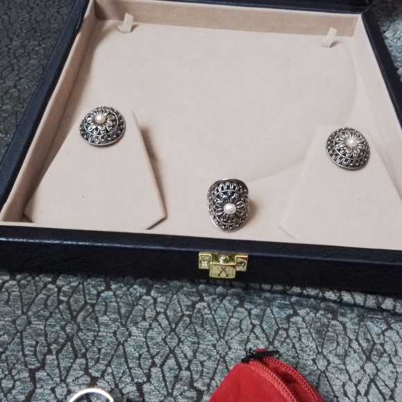 Brand new Intricately hand made 999 silver earrings and ring set.